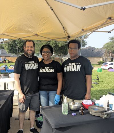Nena, Ruben and their son at a Duran Fun Lab community event